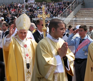 Pope Benedict XVI processes to the altar at the beginning of an open air Mass at Amman International Stadium on Sunday, May 10. (Patrick Novecosky photo)